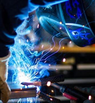 man holding gray steel frame
