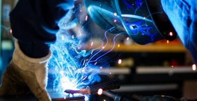 man holding gray steel frame